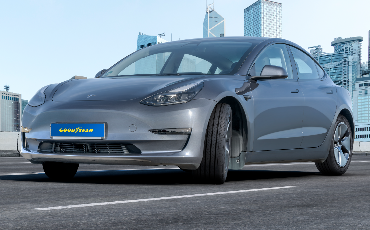 Tesla fitted with Goodyear tyres on city scape