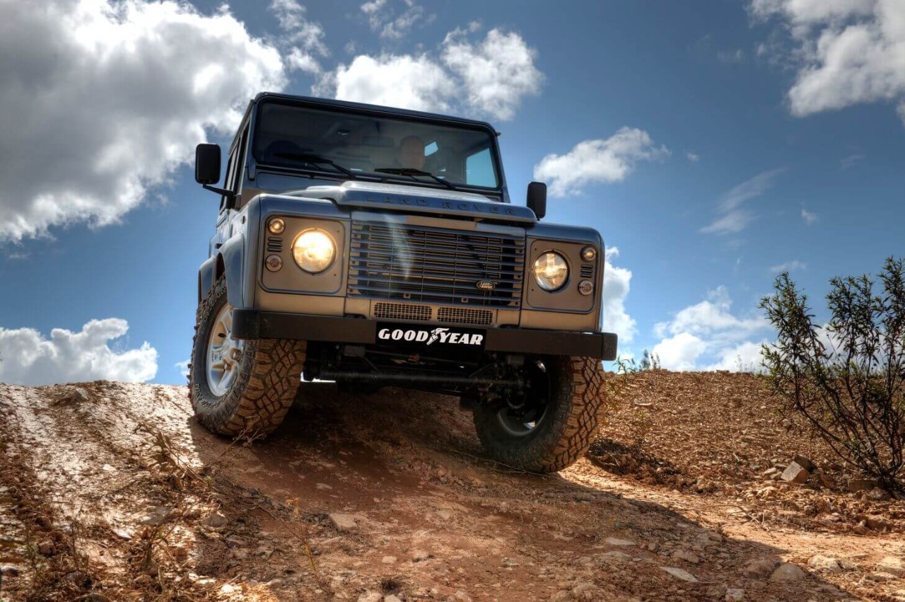 Land Rover Defender on rough terrain with Goodyear Wrangler Tyres