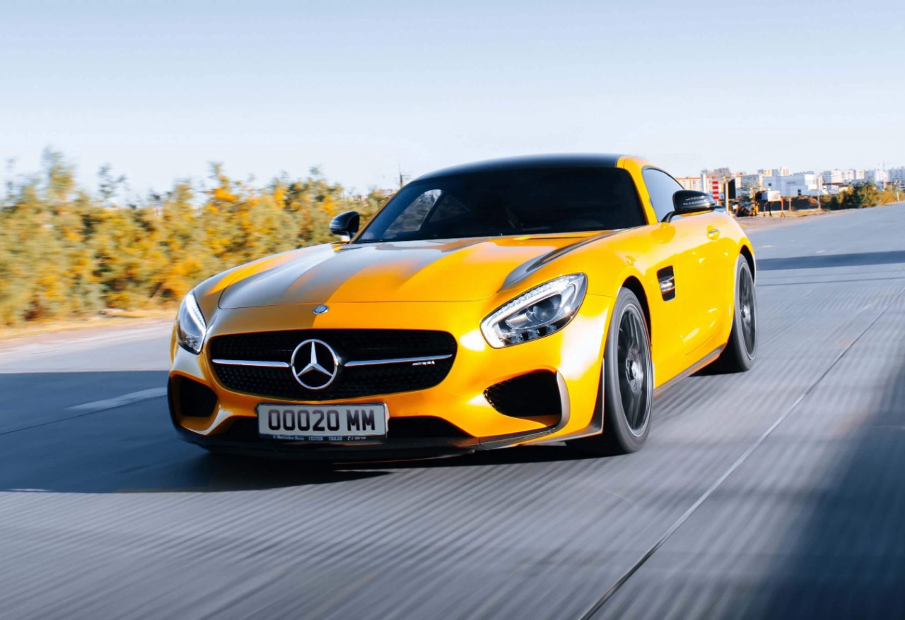 Yellow Mercedes-Benz AMG fitted with Goodyear tyres on the road