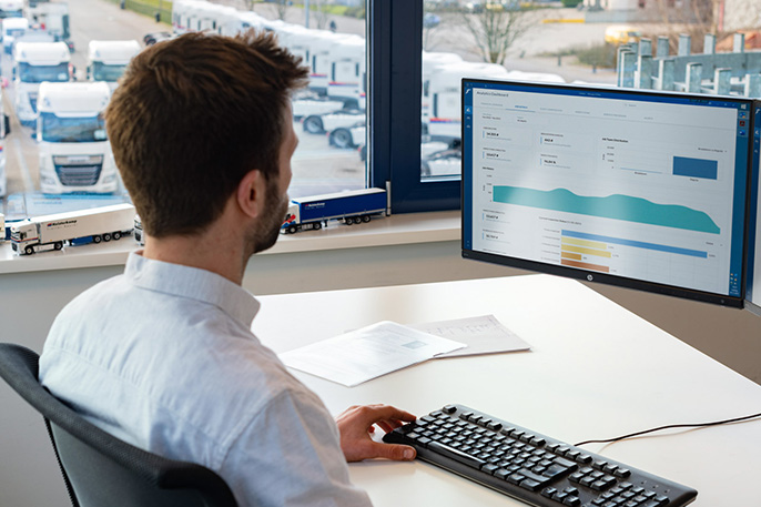 Torrello fleet manager analysing Goodyear fleet data on a desktop screen.